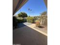 Private patio area with low maintenance landscaping and a view of the surrounding community at 10404 W Tropicana S Cir, Sun City, AZ 85351