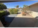 Secluded patio area offering a relaxing outdoor space with privacy and views of neighborhood at 10404 W Tropicana S Cir, Sun City, AZ 85351
