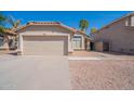 Charming single-story home with a two car garage and desert landscaping at 1110 W Seagull Dr, Chandler, AZ 85286