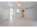 An open living space with tile floors and an open view of the kitchen at 1110 W Seagull Dr, Chandler, AZ 85286