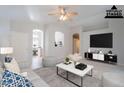 Bright living room with tile flooring, ceiling fan, and open concept design at 1110 W Seagull Dr, Chandler, AZ 85286