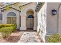 Inviting front entrance featuring double doors, an arched entryway, and manicured landscaping at 1331 E Voltaire Ave, Phoenix, AZ 85022