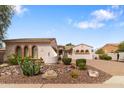 Charming single-story home with well-maintained desert landscaping and a paved driveway at 14010 N 12Th St, Phoenix, AZ 85022