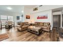 Bright living room with hard surface floors, neutral colors, and an open floor plan at 14300 W Bell Rd # 307, Surprise, AZ 85374