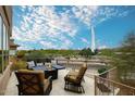 Relaxing outdoor patio space with comfortable seating, a fire pit, and scenic views at 17234 E Sunscape Dr, Fountain Hills, AZ 85268