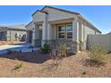 Close up of home featuring covered porch with desert landscaping at 18809 W Wilson St, Buckeye, AZ 85326