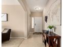 Inviting home entryway with neutral walls, tile flooring, and stylish console table adding a touch of elegance at 20905 N Danielle Ave, Maricopa, AZ 85138