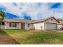 Charming single-story home with a desert-landscaped front yard and attached garage at 2327 W Rockwell Ct, Chandler, AZ 85224