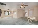Open living room featuring a white piano and mirrors accenting the wall at 2327 W Rockwell Ct, Chandler, AZ 85224