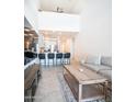 Contemporary living room with an open view of the modern kitchen and a comfortable sectional sofa at 2511 W Queen Creek Rd # 479, Chandler, AZ 85248