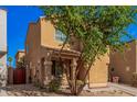 Attractive two-story house with desert landscaping, a front porch, and well-maintained surroundings at 335 S Travis --, Mesa, AZ 85208