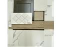 A curated selection of interior finishes including kitchen backsplash, countertops, flooring, carpet and cabinet colors at 4924 W Capistrano Ave, Laveen, AZ 85339
