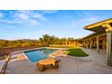 Gorgeous backyard pool with views of the surrounding desert landscape at 5480 E Desert Creek Ln, Cave Creek, AZ 85331