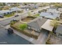 Aerial view showcasing a charming single-story home with an enclosed, landscaped front yard at 660 E 1St Ave, Mesa, AZ 85204