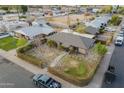 Aerial view displaying the layout of the house, driveway, and enclosed yard space at 660 E 1St Ave, Mesa, AZ 85204
