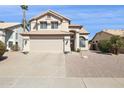 Charming two-story home with a tile roof, desert landscaping and a spacious two car garage at 9264 E Hillery Way, Scottsdale, AZ 85260