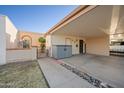 Spacious covered carport provides ample parking and leads to a charming courtyard and the home's entrance at 1005 W Berridge Ln, Phoenix, AZ 85013