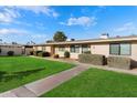 Inviting single-story homes with well-maintained lawns, sidewalks, and beautiful landscaping at 10924 W Santa Fe Dr, Sun City, AZ 85351