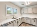 Modern kitchen featuring stainless steel appliances, stone counter tops and sleek cabinets at 11229 E Emelita Ave, Mesa, AZ 85208