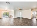 Bright and airy living room with hard floors and sliding door to the yard at 11229 E Emelita Ave, Mesa, AZ 85208