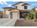 Charming two-story home with a three car garage and a welcoming front porch at 12132 W Daley Ln, Sun City, AZ 85373