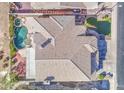 Overhead view of a home highlighting its tile roof, landscaped backyard, pool, and proximity to neighboring properties at 13236 N 13Th St, Phoenix, AZ 85022