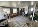 Comfortable living room with modern flooring, neutral colors, and a cozy atmosphere at 1478 W Blackfoot Ave, Apache Junction, AZ 85119