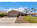 Charming single-story home featuring a well-maintained front yard with a two car garage at 1753 E Pinto Dr, Gilbert, AZ 85296