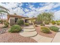 Inviting single-story home with well manicured desert landscaping at 20230 N Sojourner Dr, Surprise, AZ 85387