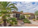 Attractive desert landscaping enhances this single-story home's curb appeal at 20230 N Sojourner Dr, Surprise, AZ 85387