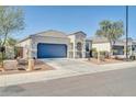 Charming single-story home with a well-maintained front yard and a two-car garage at 214 N 190Th Dr, Buckeye, AZ 85326