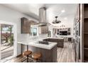 Modern kitchen featuring white countertops, stainless steel appliances, and a central island at 22005 N 86Th Ave, Peoria, AZ 85383