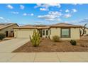 Well maintained front yard. The desert landscaping provides a clean look at 25320 W Heathermoor Dr, Buckeye, AZ 85326