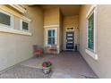 Inviting front porch featuring seating area and a stylish front door at 3431 E Canary Ct, Chandler, AZ 85286