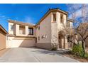 Beautiful two-story home featuring a large driveway, neutral stucco, and unique architectural details at 3603 S Weaver Cir, Gilbert, AZ 85297