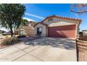 Attractive single-story house with a two-car garage and a meticulously maintained front yard at 38226 N Kyle St, San Tan Valley, AZ 85140