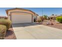 Charming single-story home featuring a two-car garage and low maintenance desert landscaping at 3921 E Runaway Bay Pl, Chandler, AZ 85249