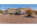 This cozy single-story home includes desert landscaping and a two car garage at 3921 E Runaway Bay Pl, Chandler, AZ 85249