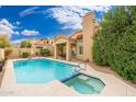 Backyard pool and spa with desert landscaping at 4151 E Mercer Ln, Phoenix, AZ 85028