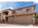 Beautiful two-story home with a three car garage and neutral stucco exterior at 45105 W Horse Mesa Rd, Maricopa, AZ 85139