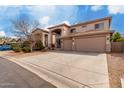 Beautiful two-story home with a three car garage, neutral stucco exterior, and landscaped front yard at 45105 W Horse Mesa Rd, Maricopa, AZ 85139