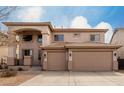 Beautiful two-story home with a three car garage and neutral stucco exterior at 45105 W Horse Mesa Rd, Maricopa, AZ 85139