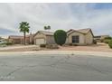 Well-maintained single-story home with desert landscaping, and convenient two-car garage at 6050 S Crosscreek Ct, Chandler, AZ 85249