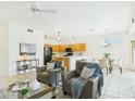 Bright and airy living area with tile floors and seamlessly connected to the kitchen and dining space at 6050 S Crosscreek Ct, Chandler, AZ 85249