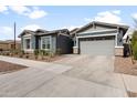 Charming home with a gray exterior, a two-car garage, and a well-maintained driveway at 10322 E Topaz Ave, Mesa, AZ 85212