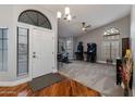 Bright foyer with hardwood floors, a large arched window, and neutral-colored walls at 1114 S Presidio Ave, Gilbert, AZ 85233