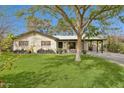 Charming single-story home with a lush lawn and mature tree at 1414 E Vermont Ave, Phoenix, AZ 85014