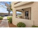 View of outdoor seating area shows neutral colors, exterior storage, and landscaping at 145 N 74Th St # 121, Mesa, AZ 85207