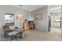 Cozy seating area with natural light and tile flooring at 15116 W Carbine Way, Sun City West, AZ 85375