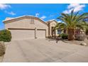 Inviting single-level home with a tidy front yard featuring desert landscaping and a spacious two-car garage at 16102 E Glenview Dr, Fountain Hills, AZ 85268